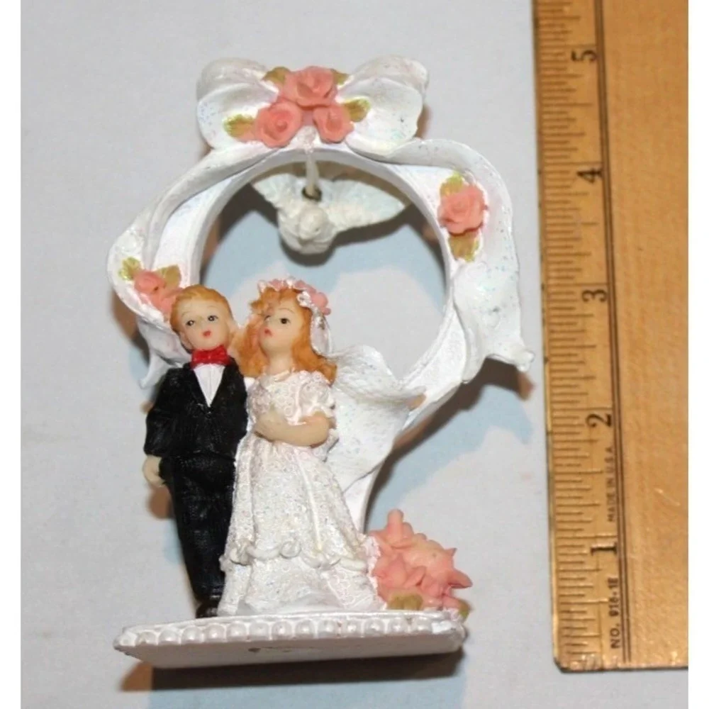 vintage bride & groom wedding cake topper with dove & ring in back